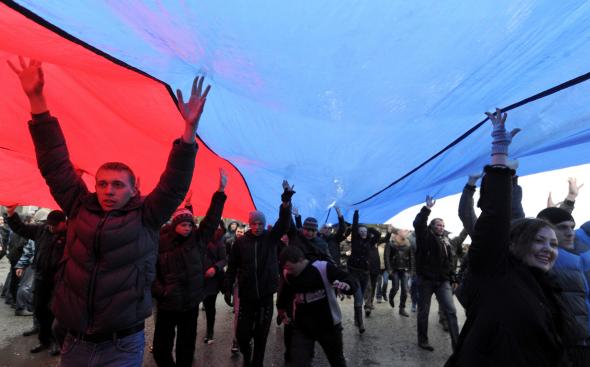 475280775-pro-russian-demonstrators-carry-a-giant-russian-flag-as.jpg.CROP.promovar-mediumlarge